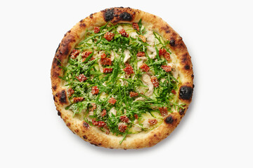 Delicious pizza with chicken, arugula, sun-dried tomatoes, and pesto on white background