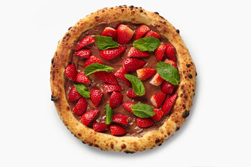 Delicious pizza covered with chocolate cream, strawberries and mint leaves