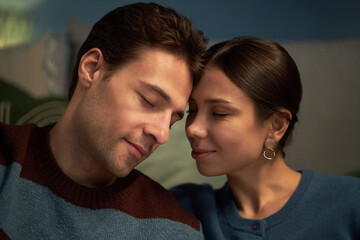 Lovely married couple enjoying time with each other at home