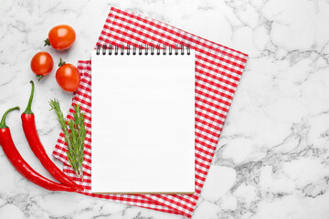 Fototapeta premium Blank recipe book and products on white marble table, top view. Mockup for design