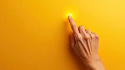 A human hand gently touches a glowing light on a bright yellow wall, symbolizing connection and interaction with light and warmth in a vibrant, inviting environment.