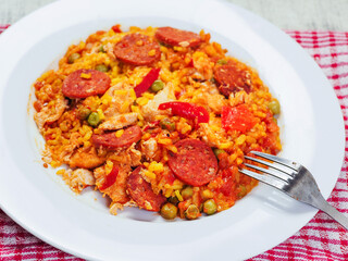 Fine tasty Spanish paella dinner with rice and high quality chorizo sausage. Mediterranean style dish. Popular food made from premium ingredients.