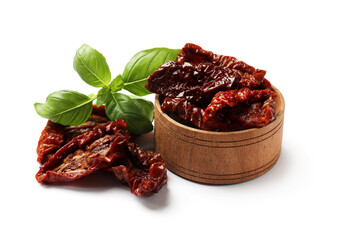 Delicious sun dried tomatoes and basil isolated on white