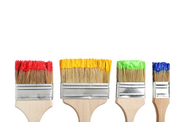 Brushes with different paints isolated on white
