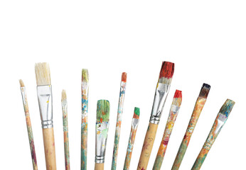 Brushes with different paints isolated on white