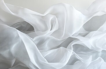 Obraz premium Soft, flowing white fabric drapes in folds. Light and airy texture