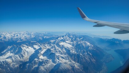 Obraz premium High mountain peaks seen from an airplane window