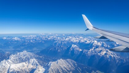 High mountain peaks seen from an airplane window