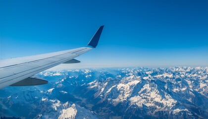 Obraz premium High mountain peaks seen from an airplane window