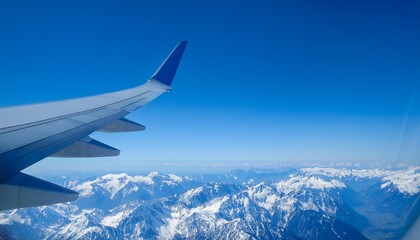 High mountain peaks seen from an airplane window