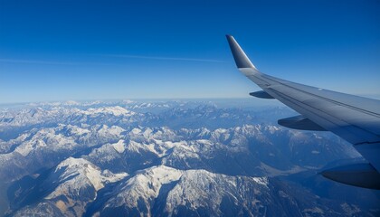 Obraz premium High mountain peaks seen from an airplane window