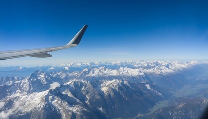 Fototapeta premium High mountain peaks seen from an airplane window