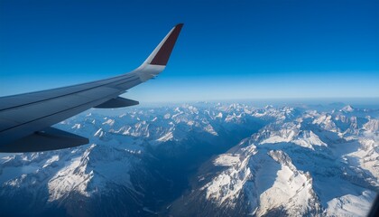 High mountain peaks seen from an airplane window