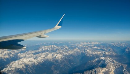 Obraz premium High mountain peaks seen from an airplane window