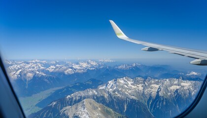 High mountain peaks seen from an airplane window