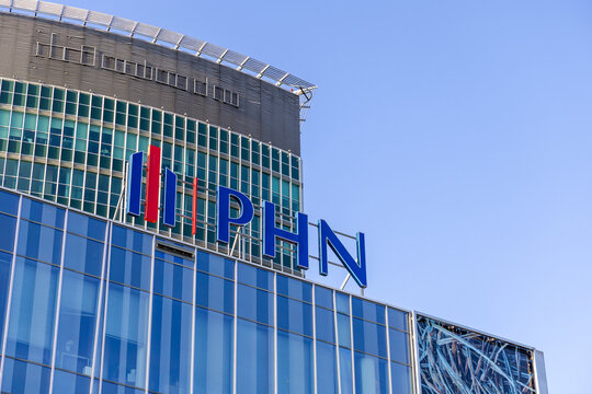 Polski Holding Nieruchomosci (PHN) office building showcases modern glass facade with large blue PHN letters, signifying corporate real estate presence