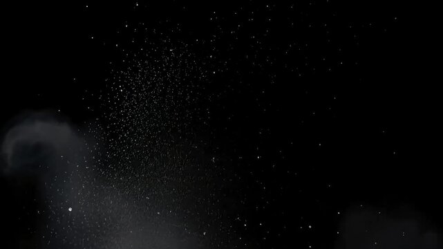 Stock footage of dust particles floating in space with smoke on a black background