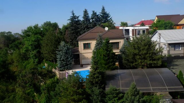 Scenic view of residential houses in Almaty captured while descending by funicular from Kok Tobe viewpoint. Urban landscape and travel concept in Kazakhstan