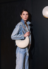 Girl model in the interior in stylish clothes with a bag. style fashion. © Streetstylephoto