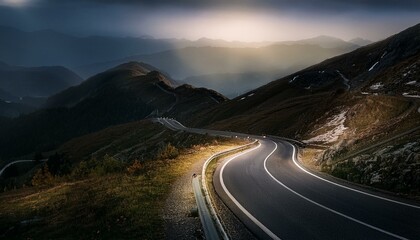 Asphalt road in mountains at night