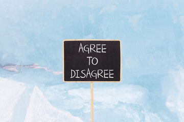 Agree to disagree symbol. Concept words Agree to disagree on beautiful blackboard. Beautiful blue...