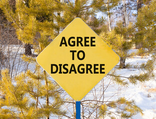 Agree to disagree symbol. Concept words Agree to disagree on beautiful yellow road sign. Beautiful...