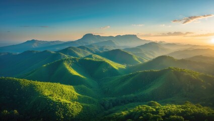 Wide-angle aerial shot of verdant montane forest slopes with setting sun over African mountains