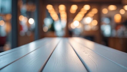 Empty wood desk top with blurred abstract backdrop suitable for business and design presentation