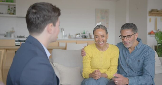 Couple reviewing plans with a consultant