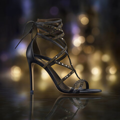 Obraz premium Elegant black high-heeled sandal with intricate details on display at a fashion event