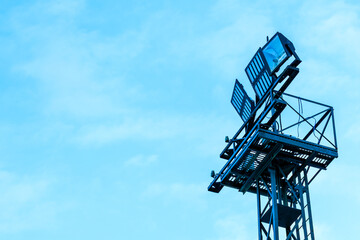 a tall tower with a floodlight