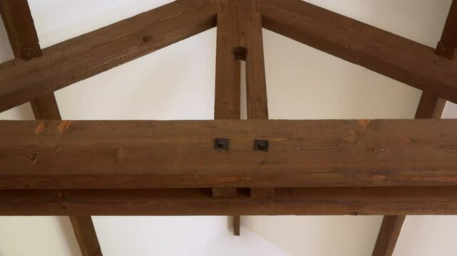 Wooden interior ceiling beams sliding shot stock footage
