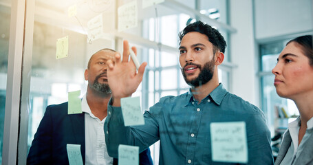 Teamwork, ideas and business people at glass with collaboration, sticky note and brainstorming in office. Strategy, problem solving and planning with moodboard for growth, development and discussion