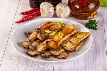 Roasted eringi mushrooms in the plate