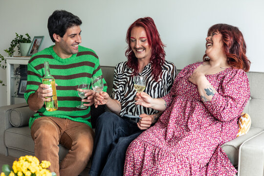 Friends toasting with white wine, celebrating diversity and body positivity