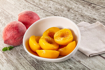 Sweet ripe yellow canned peaches