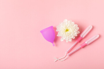 Menstrual cup on a bright background. Sanitary napkins, tampons and menstrual cup.Concept of...