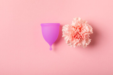 Menstrual cup on a bright background. Sanitary napkins, tampons and menstrual cup.Concept of...