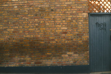 A highly detailed photo of a red brick wall with artistic lighting. weather: . mood: moody and...