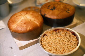 A highly detailed photo of a bowl of muffins next to a bowl of muffins with artistic lighting. weather: . mood: neutral and natural.