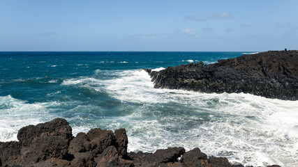 Rocky coast of the Atlantic ocean with waves.