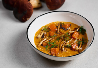 soup in plate with mushrooms