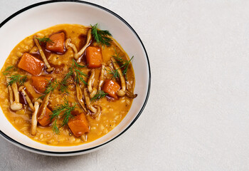 soup in plate with mushrooms