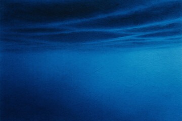 Fototapeta premium Atmospheric blue waters depicting depth and underwater ambiance in abstract artistic rendering