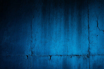 Obraz premium Textured blue concrete wall surface with dark shadows and visible cracks and imperfections