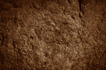 Brown rocky surface texture. Brown natural stone mountain background.