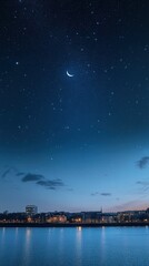 Night cityscape, crescent moon, starry sky, calm water.