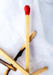 burnt matches on a white background