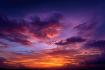Fototapeta premium Fiery Sunset Cloudscape: A Dramatic and Serene Sky
