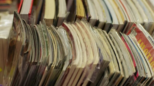 Comic shop market, books in protective sleeves inside a cardboard box for preservation and protection